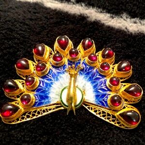 Vintage Peacock, gold plated silver Brooch. Back plumage in Garnet stones.